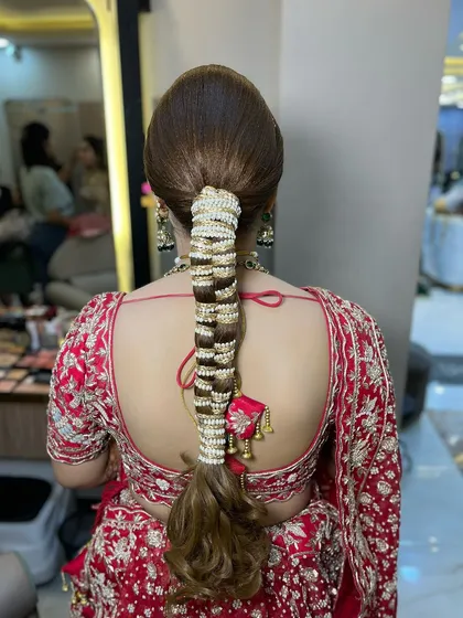 Another view of this stunning bridal braid, showing how it looks from the back. It's a perfect style to complement a heavily embroidered blouse.