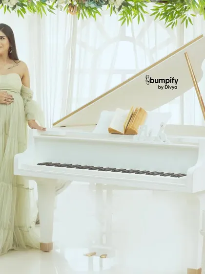A solo portrait of the mom-to-be at our white grand piano. Dressed in a light green gown, she looks like she's composing a lullaby for her little one.