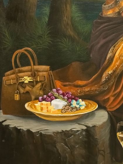 A close-up of the luxury handbag and cheese platter in "Moonlight and Monroe," grounding the mythical scene with objects of modern indulgence.