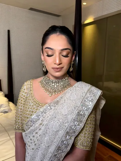 A close-up of the eye makeup for this high-profile event. I used soft, shimmering golden tones to create a look that was elegant, timeless, and camera-ready.