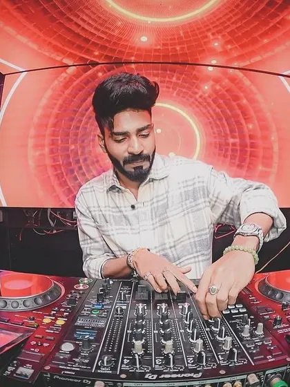 Focused and in the zone at Error Beer & Pub. Behind all the energy and hype, it comes down to the craft: reading the crowd and selecting the perfect track. Here, I'm locked into the mix, preparing for the next drop.