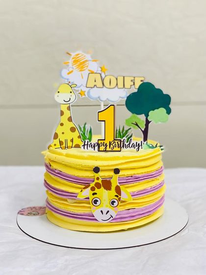 Another angle of the adorable giraffe-themed first birthday cake.