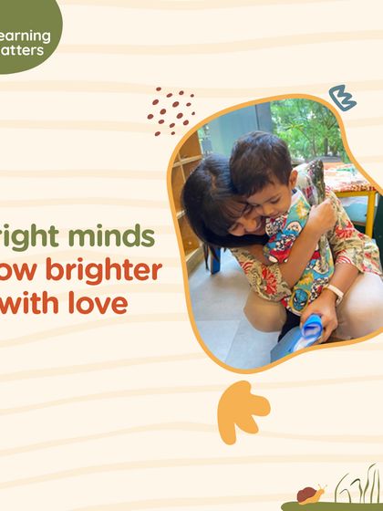 Bright minds grow brighter with love. This image of an educator and child sharing a warm hug embodies our belief that secure, nurturing relationships are as crucial to learning as books and play.