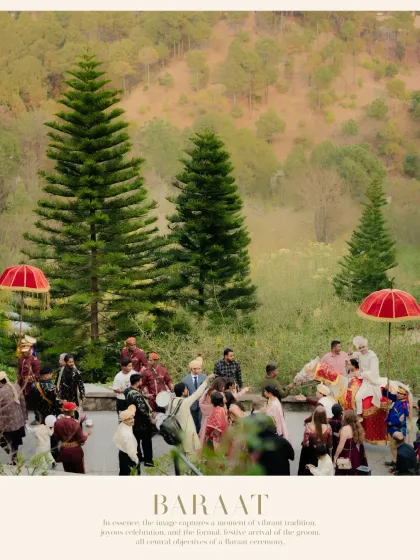 A classic Baraat scene in the hills. The groom arrives on a decorated horse, led by a procession of family and friends, with traditional red umbrellas adding a pop of color.