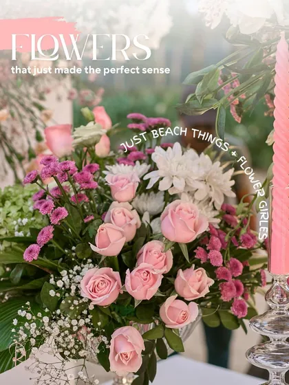 A beautiful arrangement of pink roses and other complementary flowers, perfectly suited for the beachside setting.