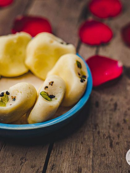 A close-up of our soft and grainy Pedas, garnished with pistachios. This sweet is a staple for many festivals, especially Janmashtami.