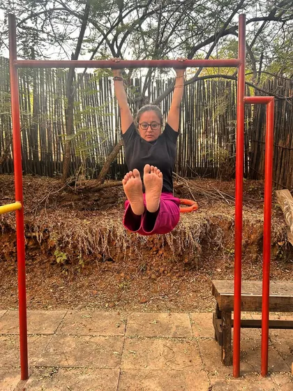 Strength training is a journey. Simple exercises like this L-sit hold, practiced outdoors, are part of my commitment to getting stronger with every practice.