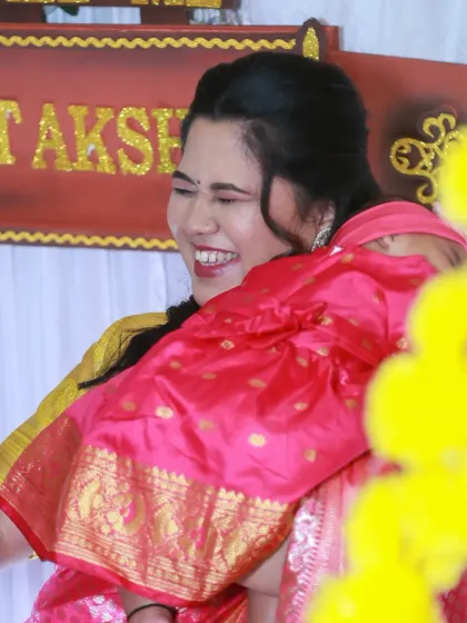 The pure joy on a new mother's face during her daughter's naming ceremony. These are the priceless emotional moments I strive to capture.