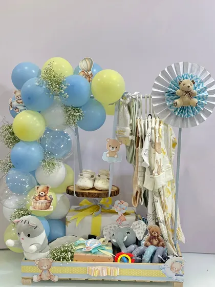 Another angle of the baby boy hamper with a clothing rack, showing the careful arrangement of gifts, toys, and balloons to create a balanced and visually appealing display.