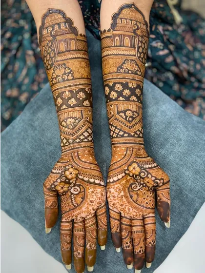 A beautiful bridal design with architectural domes and intricate patterns. The mix of bold lines and delicate details creates a stunning visual effect.