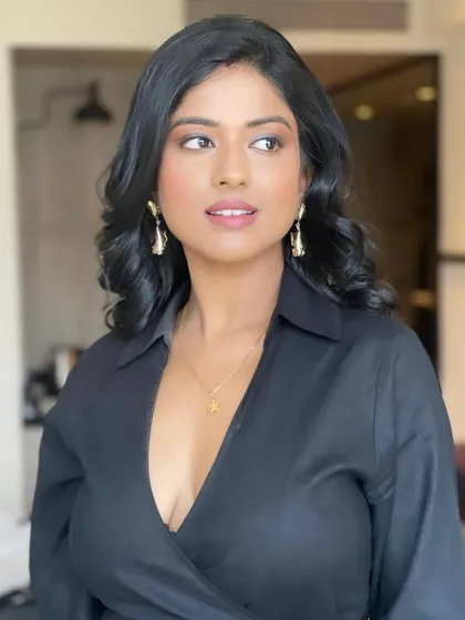 A portrait of the client, her hair styled to look modern and elegant.