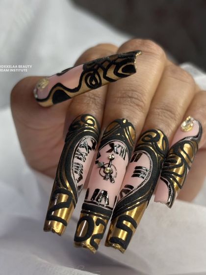 Time to shine with this stunning clock-inspired nail art, where every minute counts towards a fabulous look.