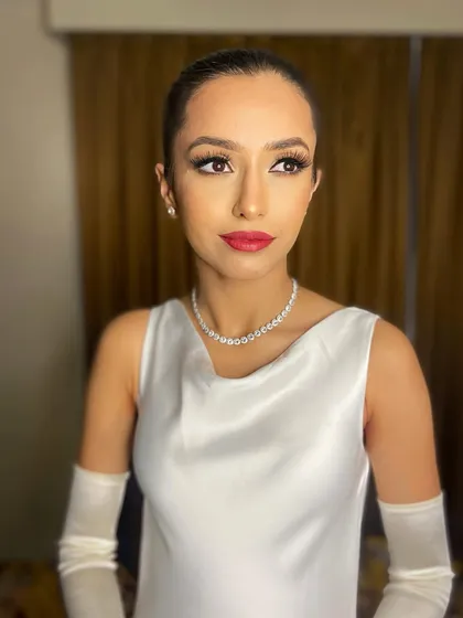 For Pawlin's reception, we went for a super chic and modern look. A classic red lip and clean, glowing skin created a timeless style that was both elegant and striking.