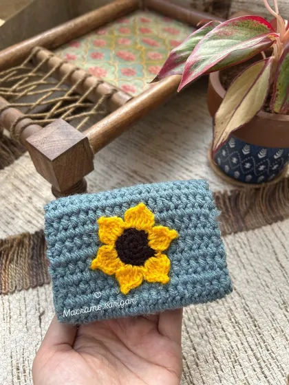 Another look at our popular sunflower mini wallet. The design is simple, cheerful, and a favorite among our customers.