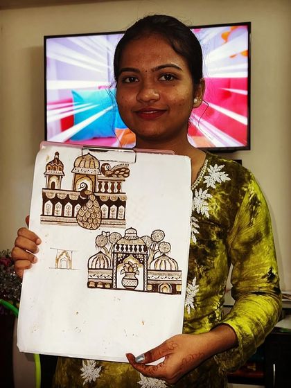 A student showcasing her practice work on architectural elements like domes and pillars, an important part of creating grand bridal scenes.