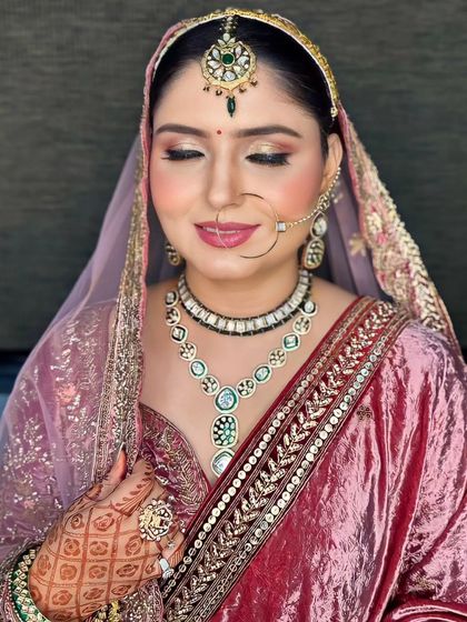A close-up of the makeup, showing the shimmery eyeshadow and the soft pink lip.
