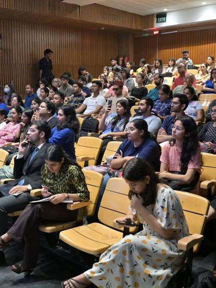 A full auditorium watches the MUN proceedings. The event attracts a large audience, highlighting the community's interest in these unique academic and cultural programs.