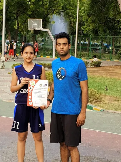 We are incredibly proud of our dedicated players. Here is our trainee, Priyanshi J., holding her certificate after representing Delhi state in the Under 16 Girls National Championship. Her hard work is an inspiration to everyone at the academy.