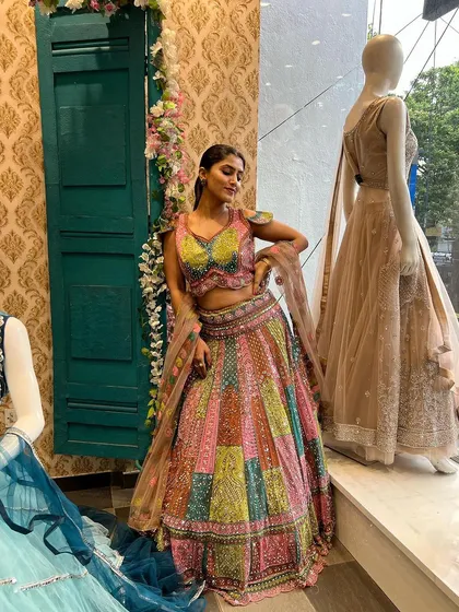 A full-length view of Chandna Gowda in our multi-color lehenga, showcasing its beautiful flare and unique design.