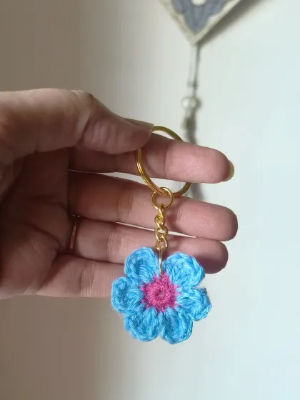 A beautiful two-tone floral keychain in light blue and pink. Each one is handmade and unique.
