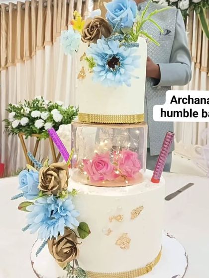 The stunning three-tiered spacer engagement cake at the event, ready for the celebration.