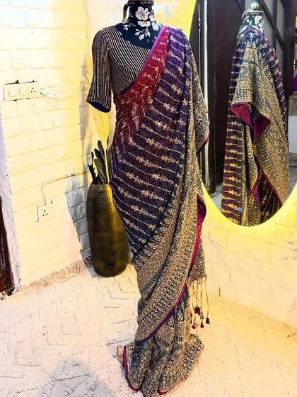 The 'ROOP' saree captured in our studio. The reflection shows the beautiful tassels and the intricate border work that completes this limited edition piece.