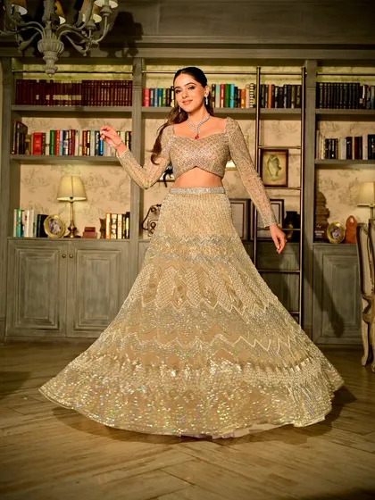 A sangeet look should be nothing short of breathtaking. For this bride, we created an elegant and powerful look with a stunning golden lehenga, focusing on glowing skin and softly sculpted features for a sophisticated finish.