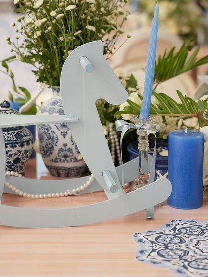 Another view of the rocking horse on the beautifully decorated table.