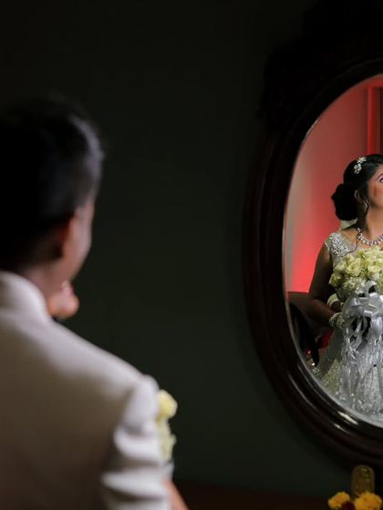 A creative portrait of a Christian couple reflected in a mirror. I use unique techniques like this to create artistic and memorable wedding photos.