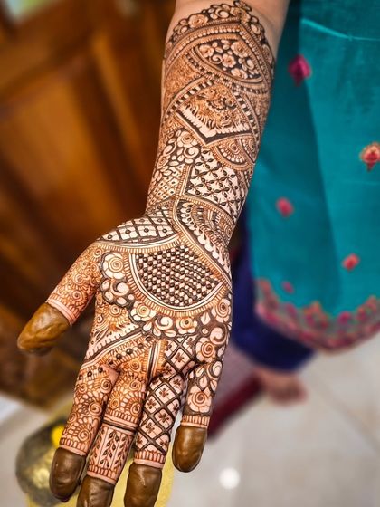 A full-arm view of this intricate design, perfect for a bride who loves detailed patterns.