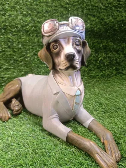 For the dog lovers, I have this beautifully crafted showpiece of a relaxing dog in a pilot's hat. The detail is incredible.