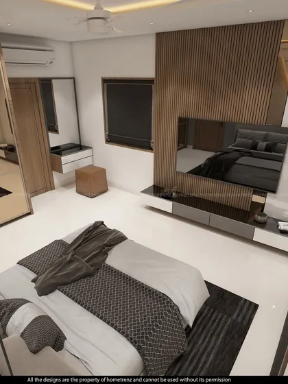 This guest bedroom features a unique headboard wall with geometric wood and white panels. The mirrored wardrobe adds depth and reflects light.