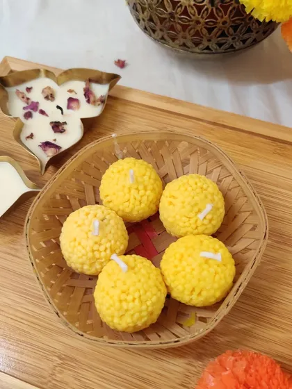 A basket full of our cheerful Ladoo candles, ready to be gifted or displayed. They bring a touch of sweetness and light to any occasion.