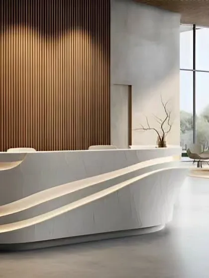 The reception area is the first handshake with your brand. For this corporate lobby, we designed a minimalist, sculptural reception desk with integrated lighting, set against a warm, vertically slatted wood wall to make a sophisticated first impression.