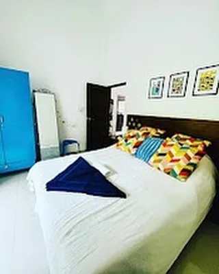 Welcome to the Blue Room, the second bedroom in the apartment. I've given this room a more lively and colorful personality. It's a bright, cheerful space, ensuring a comfortable stay for family or friends in this two-bedroom Goa rental.