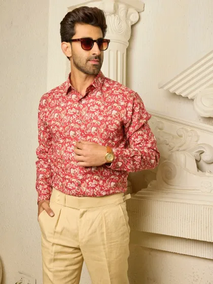 A full-length view of the red and beige floral shirt, showcasing its perfect pairing with tailored trousers for a look that is both refined and relaxed.
