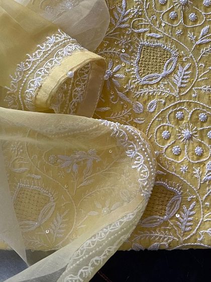 A close-up of the sleeve and dupatta border, highlighting the craftsmanship.