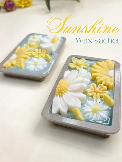 The 'Sunshine' wax sachets, fresh out of the mold. The detailed daisy and floral designs are what make them so special.