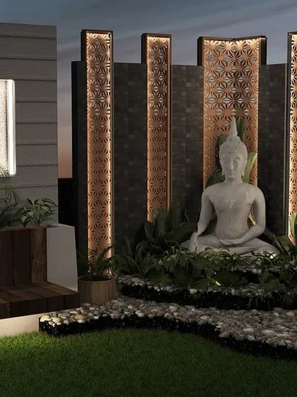 To create a corner of peace and tranquility, we placed this serene Buddha sculpture amidst pebbles and plants. The backlit decorative panels behind it add a warm glow, making this the perfect spot for morning meditation.