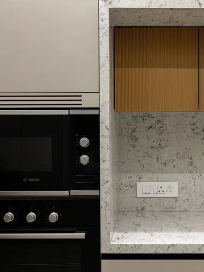 A close-up of the built-in oven and microwave unit, showcasing how appliances can be seamlessly integrated into the cabinetry for a clean, uncluttered look.