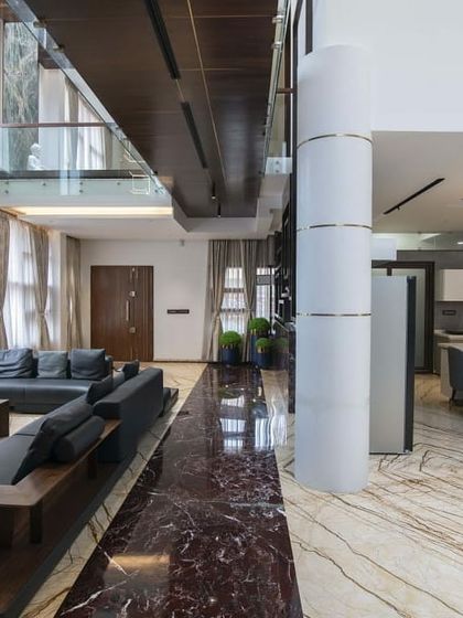 This is a duplicate of ID 61. The living area of this residence is defined by its bold use of materials, including two types of striking marble.