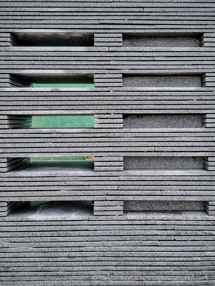 The finished mock-up of the granite screen shows the pattern of voids and solids. This hands-on testing is a core part of our design process for creating unique architectural and furniture elements.