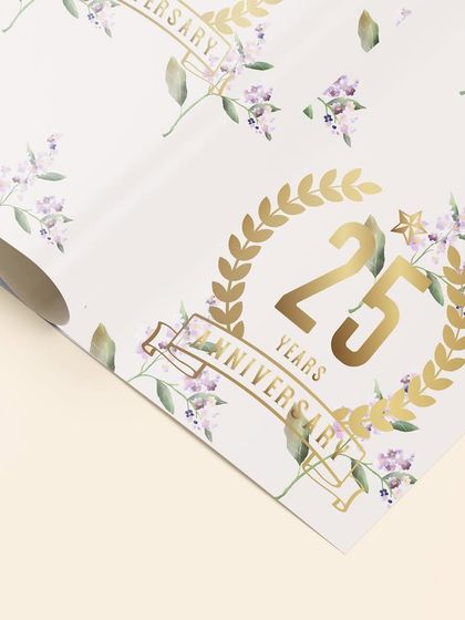 Custom gift wrap designed for a 25th anniversary. The elegant lilac floral pattern is paired with a golden anniversary crest, ensuring that even the presents match the event's sophisticated theme.