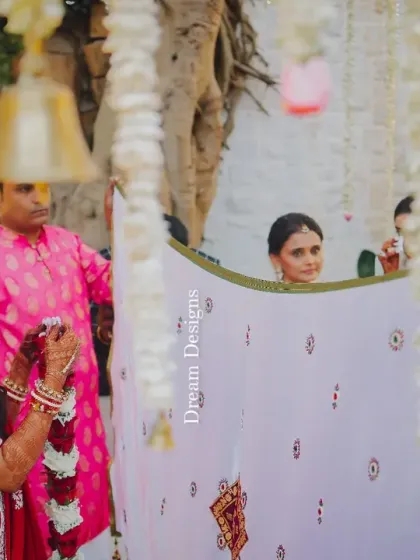 A traditional moment during an Indian wedding ceremony. The decor is designed to honor these customs while providing a beautiful and elegant setting.
