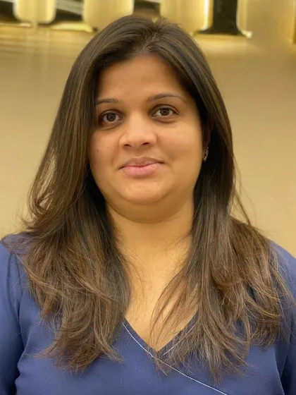 A frontal view of a client's new haircut, showing how the layers frame her face and create a flattering shape.