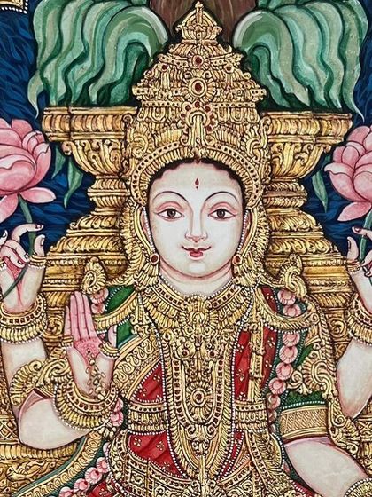 A close-up of Goddess Lakshmi's serene and benevolent face. We take great care to ensure the expressions in our paintings are captivating and full of divine grace.