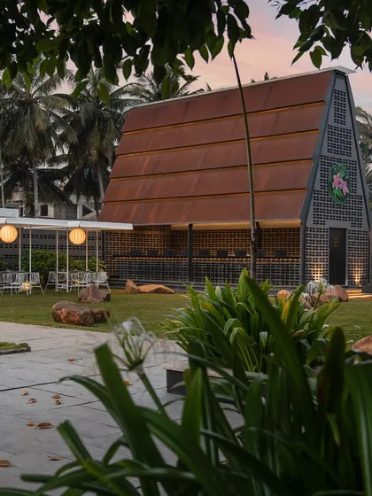 The view of our A-frame building at sunset is one of my favorites. The combination of modern architecture, soft lighting, and surrounding greenery makes for a truly serene evening setting.