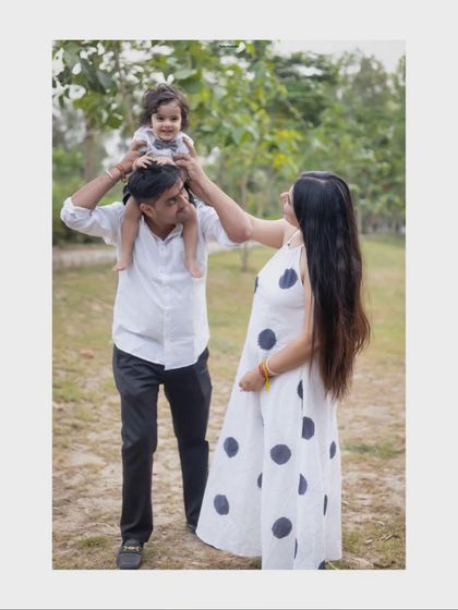 A playful family portrait taken outdoors, showing the joy and energy of being together.