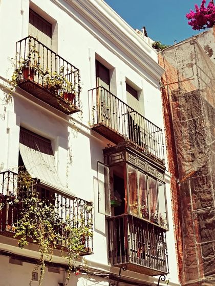 The intricate balconies and sun-bleached walls of this building in Andalusia are details that I carry with me. This connection to the land of Flamenco is something I share with my students, helping them understand the culture from which the dance originates.