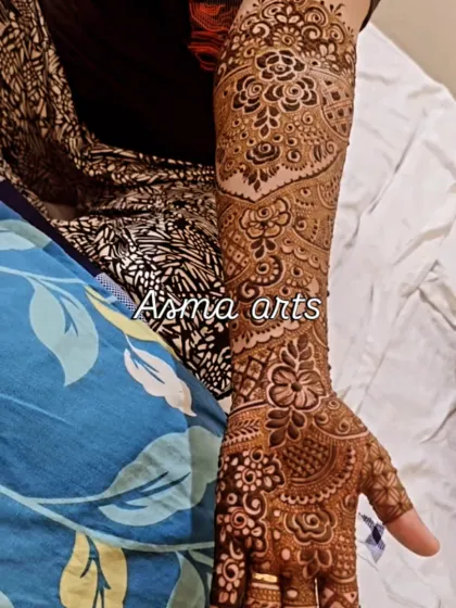 A close-up of a single arm, showcasing the density and detail of my traditional henna art. Every part of the arm is covered in beautiful, flowing patterns.